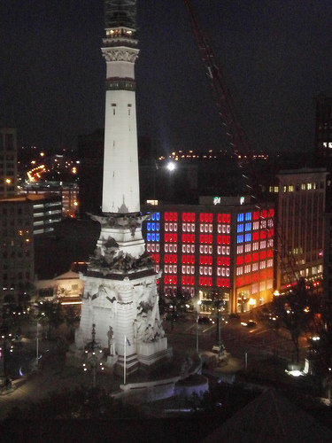 Monument lit and building lit like an American flag