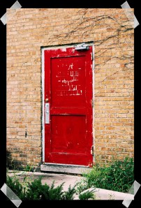 red door - photo treated to look as if taped onto black paper