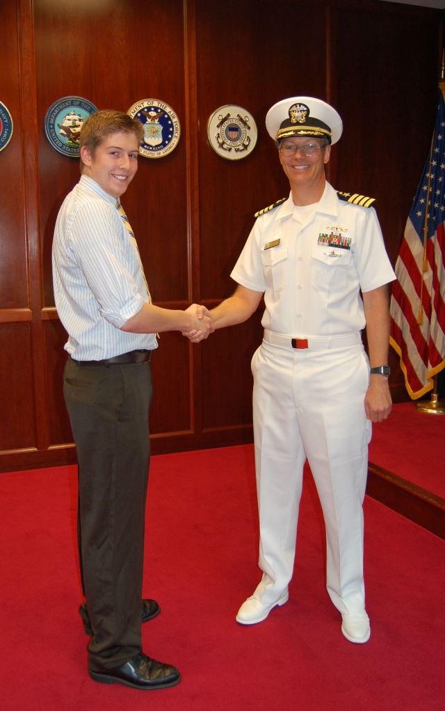 Army Nat Guard and Navy Shaking hands and smiling after swearing in ceremony
