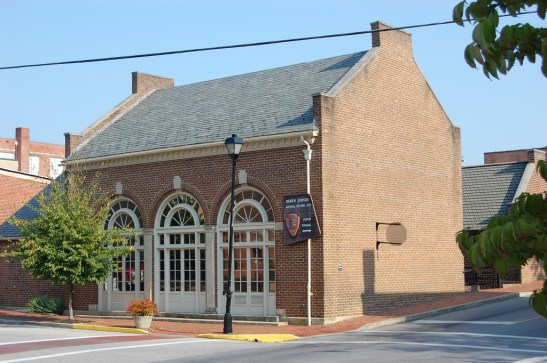 The exterior of the building built around the Johnson Tailor shop.  The addition to the building service as the visitor center for the National Park locations in Greeneville.