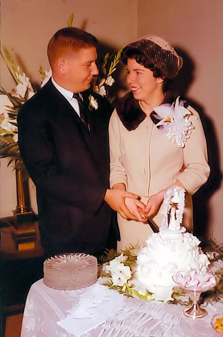 Bright, Sidney and Rolen Sylvia cut their wedding cake