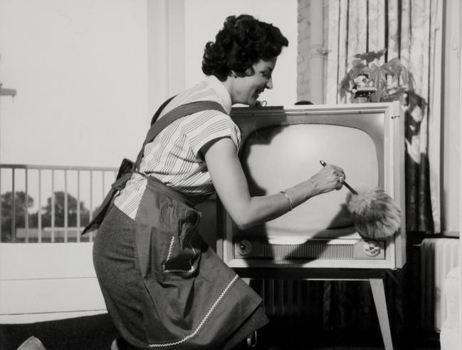 Dusting TV Set with a feather-brush from the National Archif of the Netherlands as a member of the Flickr Commons  No known copyright  restrictions.