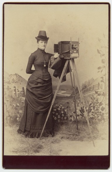 Woman with Camera from the George Eastman House on Flickr The Commons.  There are no known copyright restrictions.