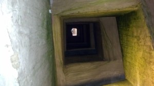Looking up a Roman well that 1600 nuns turned into a narrow stairwell to their storage.