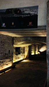 This is a view of the Roman Greenroom. The large white box there with the banner on it is the dining room of a house. These homes hacked into the Roman theater ruin within the walled city in the 1600s to expand their homes.