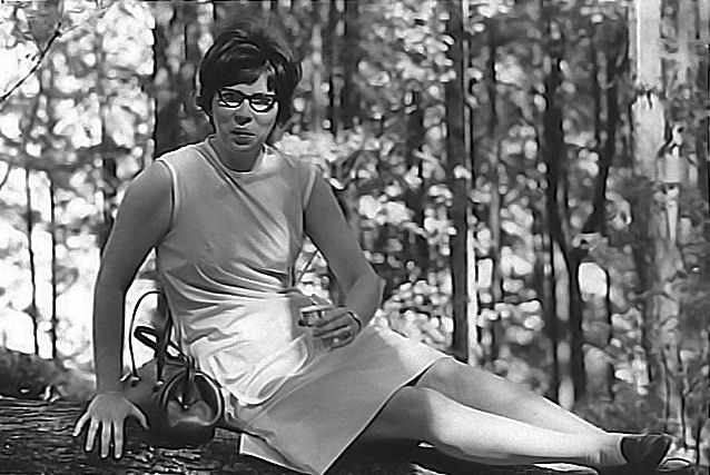 Rolen Bright, Sylvia poses on log from family collection.