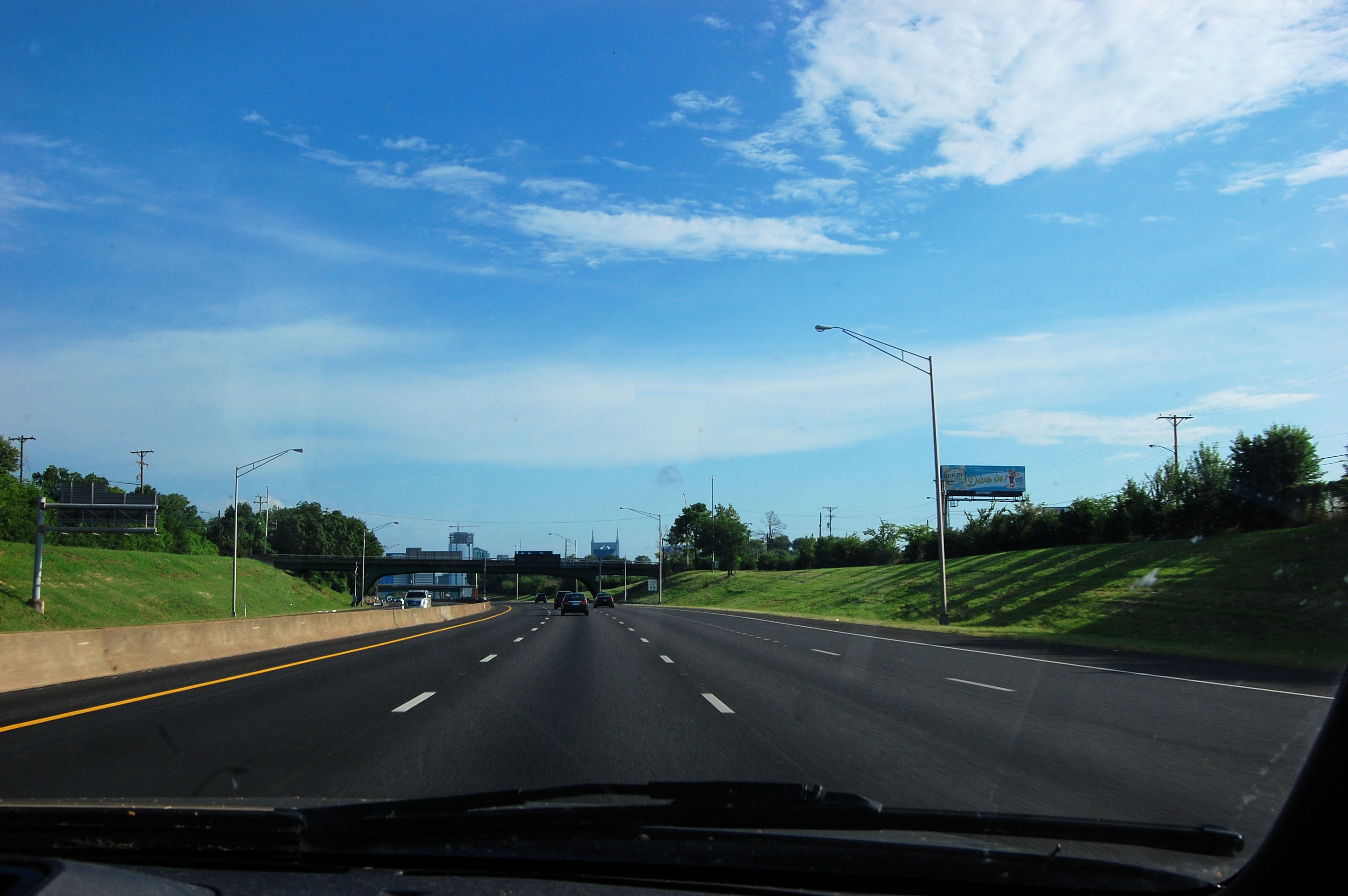 Here we are on the road and wondering if the little dark cloud up there near the Batman building in Nashville is following over someone.